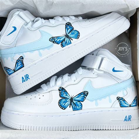 blue butterfly nike shoes.